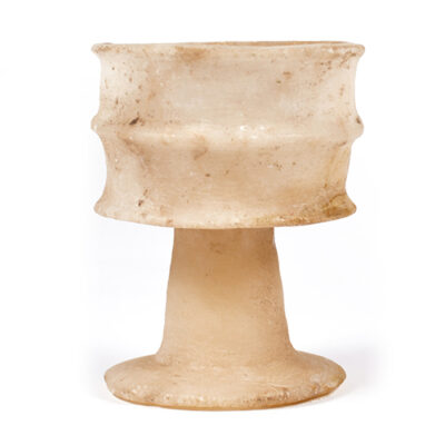 An Egyptian alabaster ribbed cup, New Kingdom, 18th dynasty, ca. 1390-1295 BC
